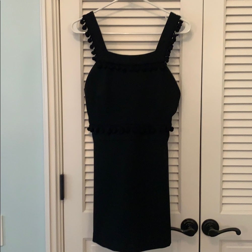 Black mini backless dress with Pom Pom detail